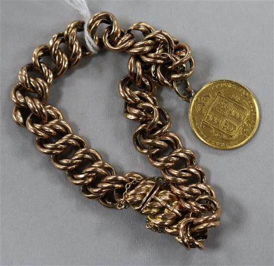 A 9ct gold bracelet hung with a gold half sovereign, gross 16.9 grams.